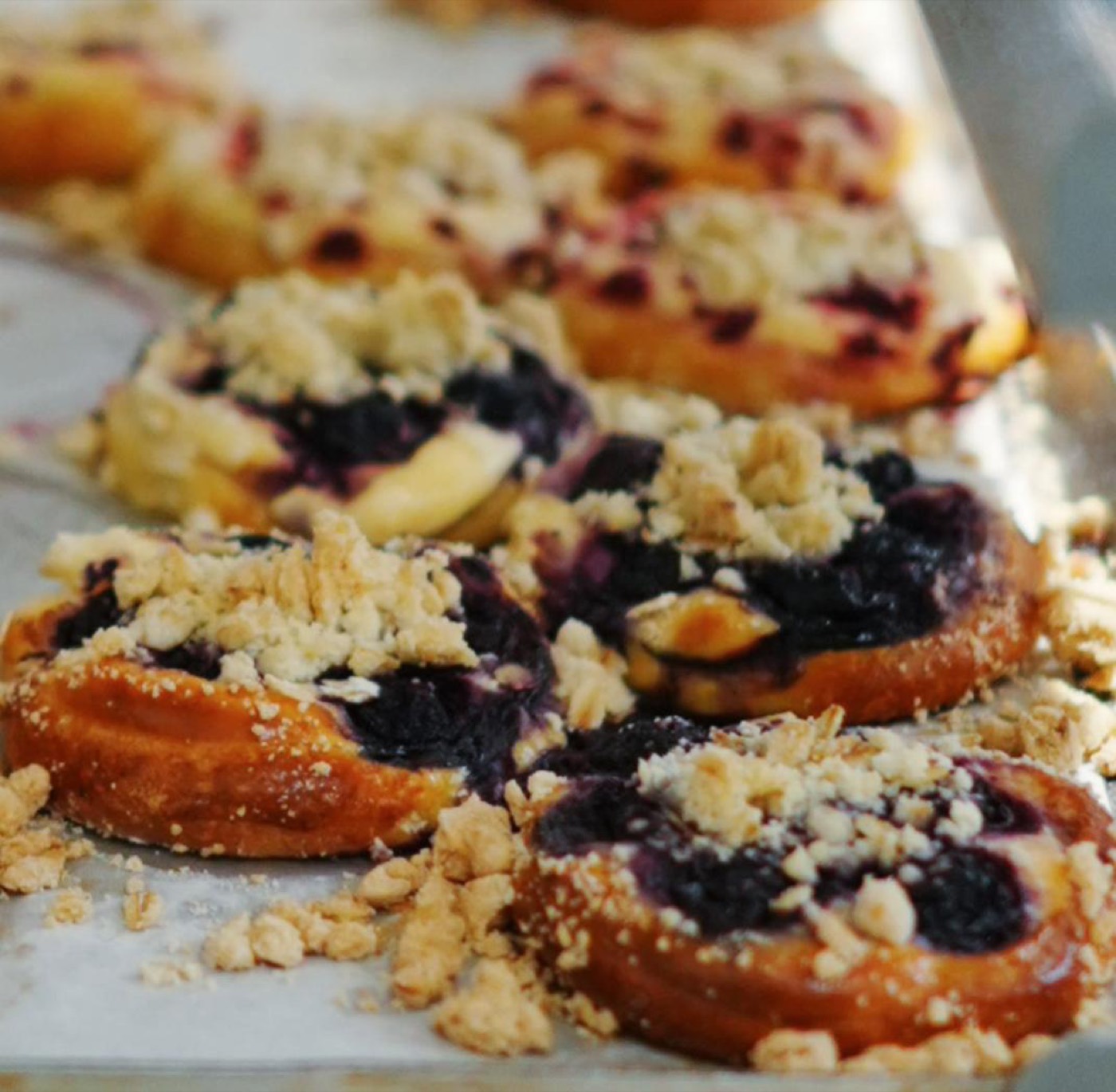 Blueberry sourdough danishes with crumble topping on a tray at LITO Bakery, Bangsar